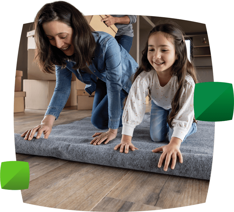 Mother and daughter rolling rug