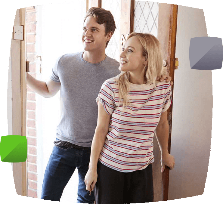 couple walking through their new front door
