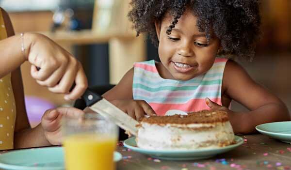 girl about to eat cake