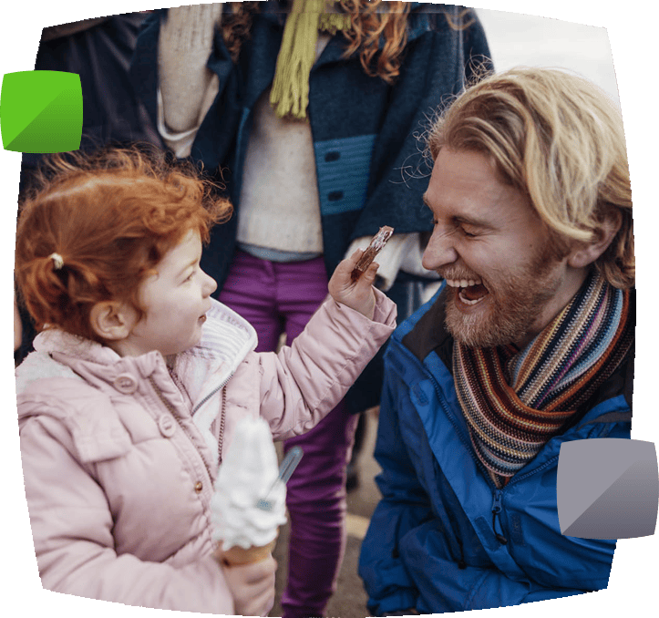 child with ice cream and man laughing