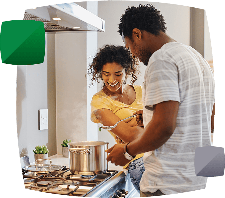 Couple cooking in kitchen