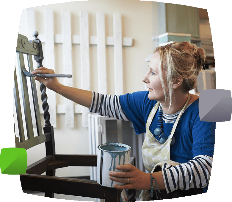 woman painting chair