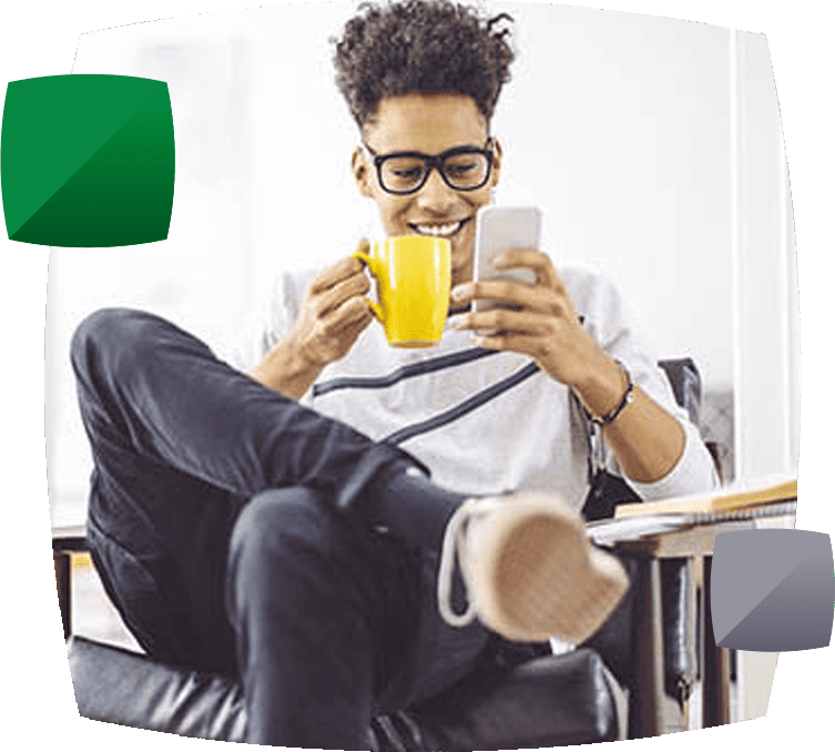 young man on phone with mug