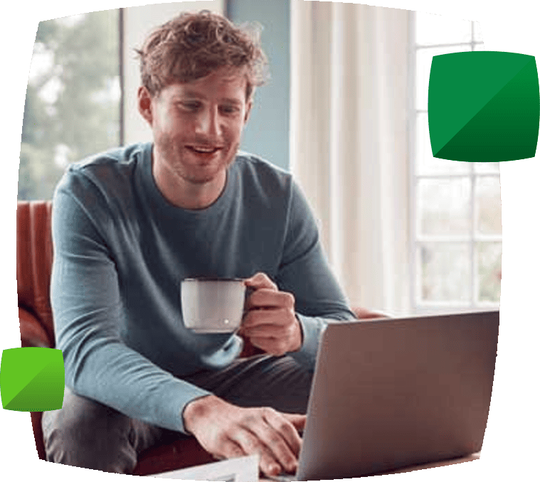 Man with laptop and mug
